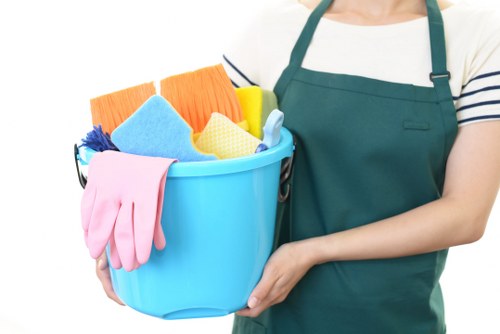 Professional cleaner working in a Sutton home with local residential cleaning focus